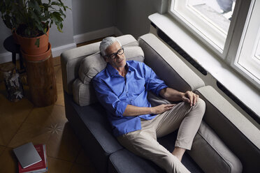 Pensive mature man on couch at home - RBF05948