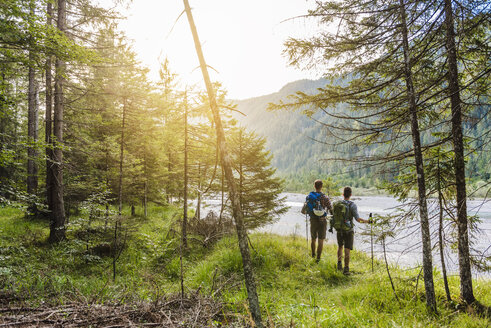 Germany, Bavaria, back view of two hikers with backpacks - DIGF02821