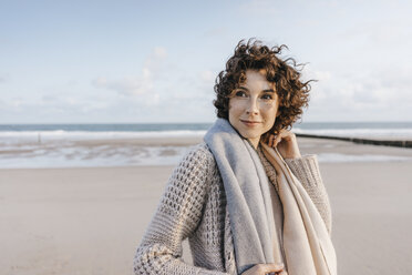 Portrait of smiling woman on the beach - KNSF02629