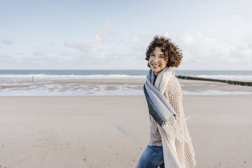 Portrait of happy woman on the beach - KNSF02630
