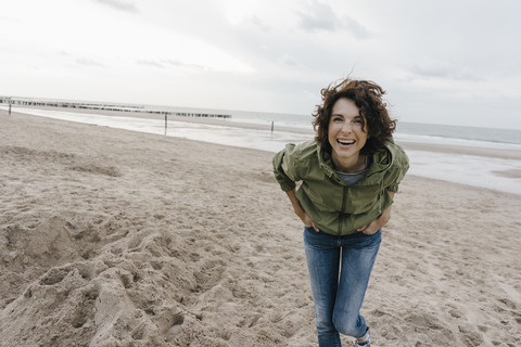 Portrait of happy woman on the beach stock photo