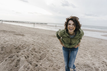 Portrait of happy woman on the beach - KNSF02706