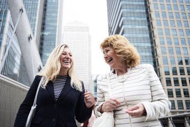 UK, London, two happy senior businesswomen in the city - IGGF00185