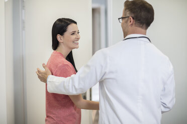 Doctor shaking hands with patient in medical practice - ZEF14565