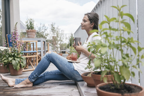 Woman relaxing on balcony - JOSF01634