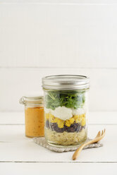 Jar of vegetarian mixed salad with Kritharaki, corn, rocket and cranberries and jar of cocktail sauce - ECF01887