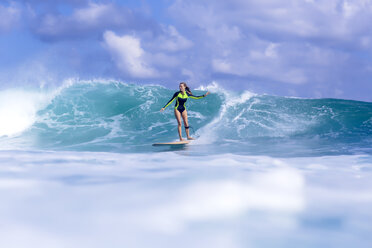 Indonesia, Bali, woman surfing - KNTF00896