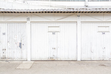 Row of three white garage doors - NGF00420