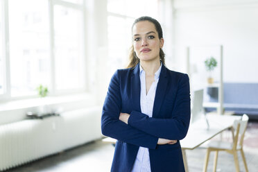 Portrait of confident businesswoman in a loft - JOSF01781