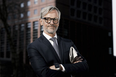 Portrait of confident grey-haired businessman outdoors - SBOF00780