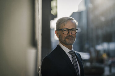 Portrait of grey-haired businessman in the city - SBOF00793