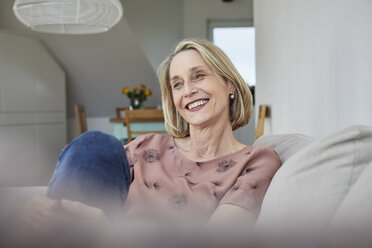 Smiling mature woman at home on the sofa - RBF06068