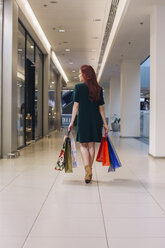 Young woman with shopping bags - MOMF00246