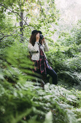 Teenage girl taking pictures in nature - VPIF00094
