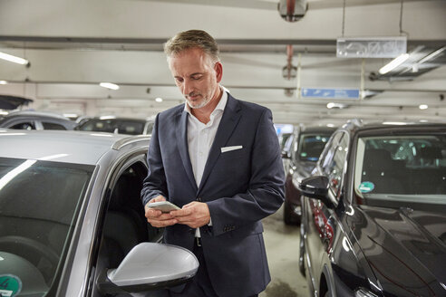 Businessman parking his car at the airport - SUF00331