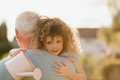 Portrait of little girl cuddling her uncle - NMSF00169