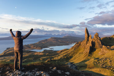 UK, Scotland, Inner Hebrides, Isle of Skye, Trotternish, tourist on peak near The Storr - FOF09390