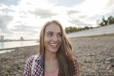 Happy young woman at the riverside - VPIF00166