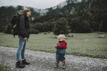 Austria, Vorarlberg, Mellau, mother and toddler on a trip in the mountains - DWF00302