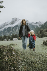 Austria, Vorarlberg, Mellau, mother and toddler on a trip in the mountains - DWF00308