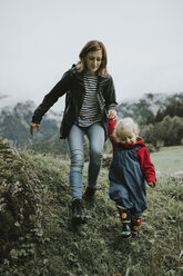 Austria, Vorarlberg, Mellau, mother and toddler on a trip in the mountains - DWF00309