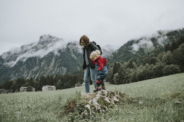 Austria, Vorarlberg, Mellau, mother and toddler on a trip in the mountains - DWF00312