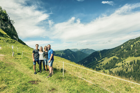 Germany, Bavaria, Pfronten, portrait of happy family on alpine meadow near Aggenstein - PNPF00014