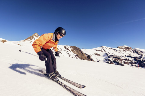 Austria, Damuels, woman skiing in winter landscape stock photo