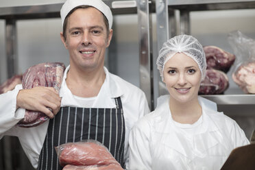 Portrait of smiling man and woman in butchery - ZEF14620