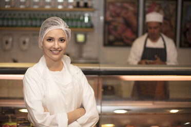 Portrait of smiling woman in butchery - ZEF14636