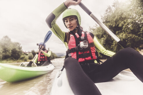 Germany, Bavaria, Allgaeu, couple kayaking on river Iller - PNPF00070