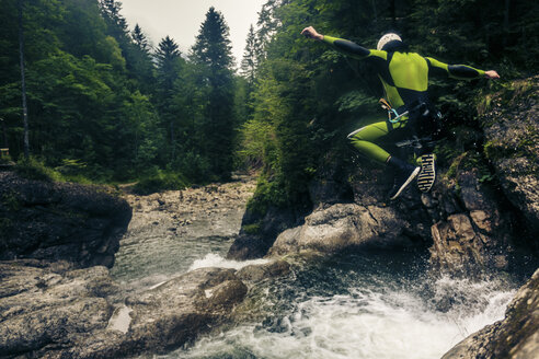 Germany, Bavaria, Allgaeu, young man canyoning in Ostertal - PNPF00086