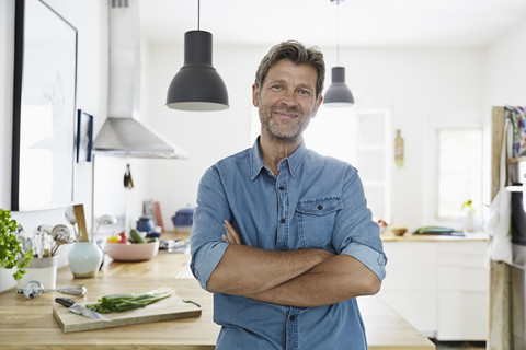 Mature man at home, looking confidet stock photo