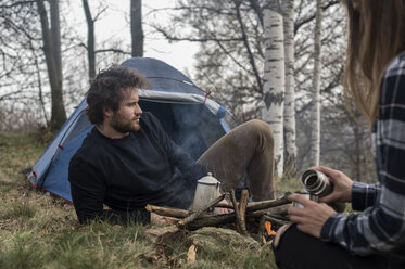 Couple camping in forest - ZOCF00508