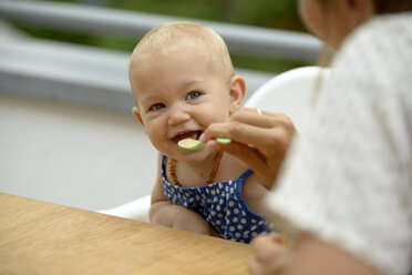 Mother feeding her baby girl - LBF01664