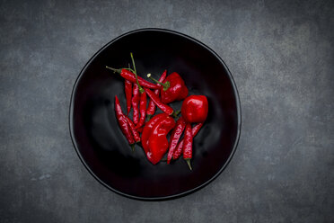 Black bowl of various red chili pods - LVF06311