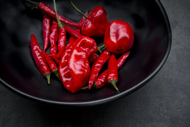 Black bowl of various red chili pods - LVF06312