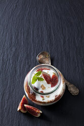 Glass of Mascarpone cream with fig compote and walnuts on slate - CSF28306