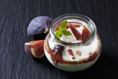 Glass of Mascarpone cream with fig compote and walnuts on slate - CSF28307