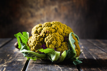 Yellow cauliflower on dark wood - CSF28342