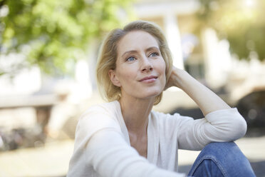 Portrait of smiling blond woman looking at distance - PNEF00014