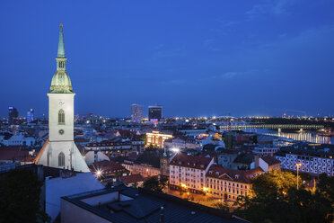 Slovakia, Bratislava, night cityscape with tower of St. Martin's Cathedral on left - ABOF00280