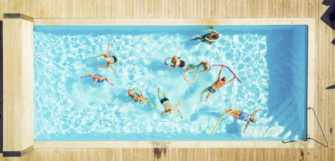 Top view of group of seniors doing water gymnastics in pool stock photo