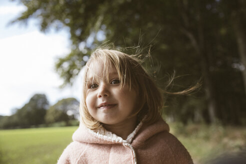 Portrait of blond little girl with blowing hair - KMKF00005