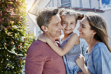 Portrait of happy family in front of their home - RORF01044