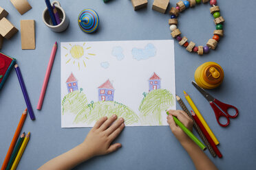 Child drawing landscape with houses - RBF06080