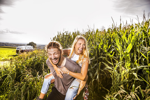 Carefree couple in cornfield stock photo