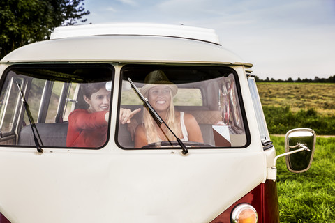 Two happy women in a van stock photo