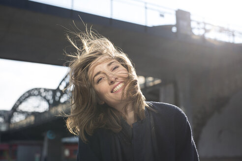 Portrait of happy woman with blowing hair - PNEF00165