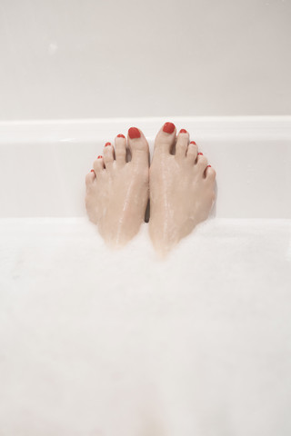 Woman's feet in bath stock photo